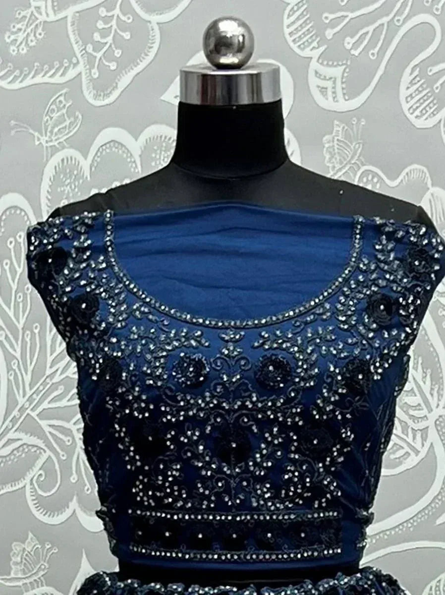 Navy blue embroidered lehenga choli top with sequin and bead detailing, displayed on mannequin