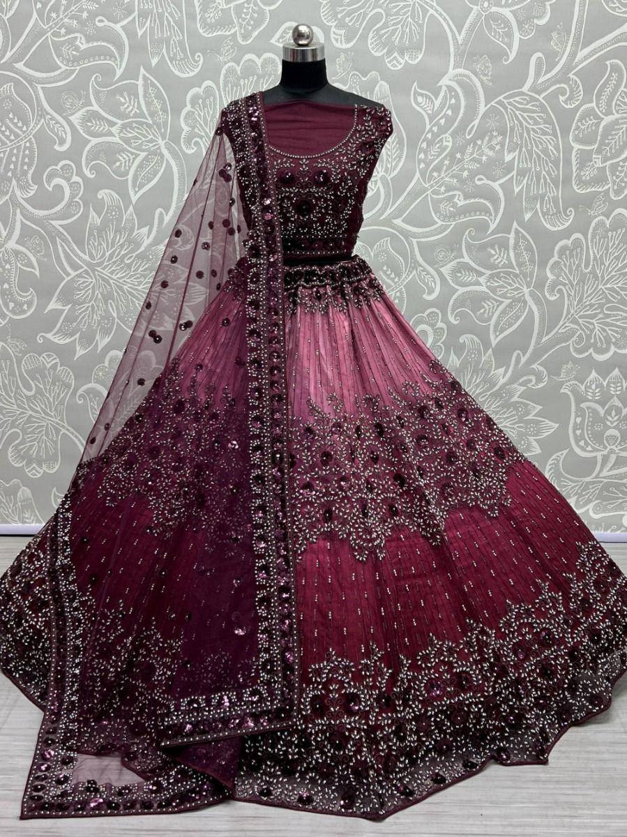 Burgundy designer lehenga choli with heavy embroidery and sheer dupatta, perfect for weddings and festive occasions