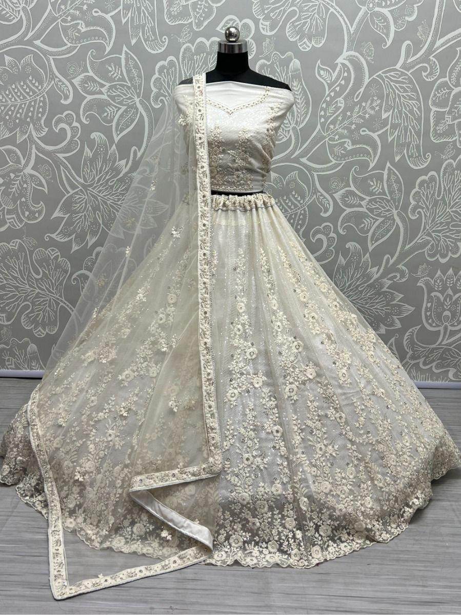 Ravishing Cream Zircon Diamond Work Net Lehenga Choli