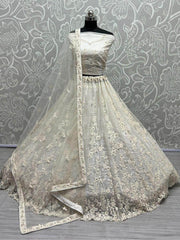 Ravishing Cream Zircon Diamond Work Net Lehenga Choli