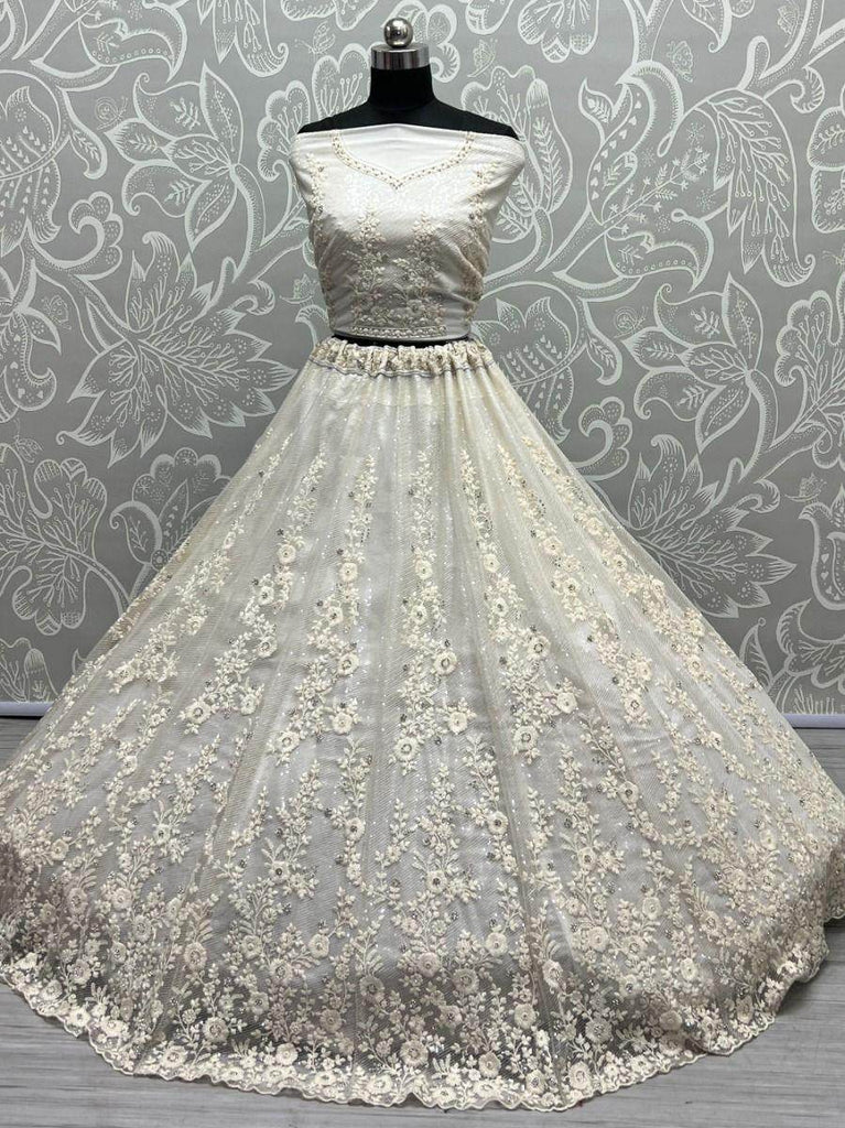 Ravishing Cream Zircon Diamond Work Net Lehenga Choli