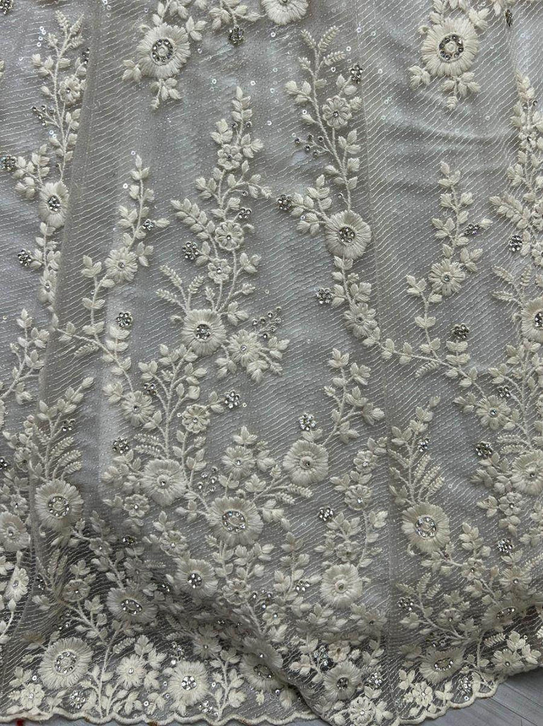 Ravishing Cream Zircon Diamond Work Net Lehenga Choli