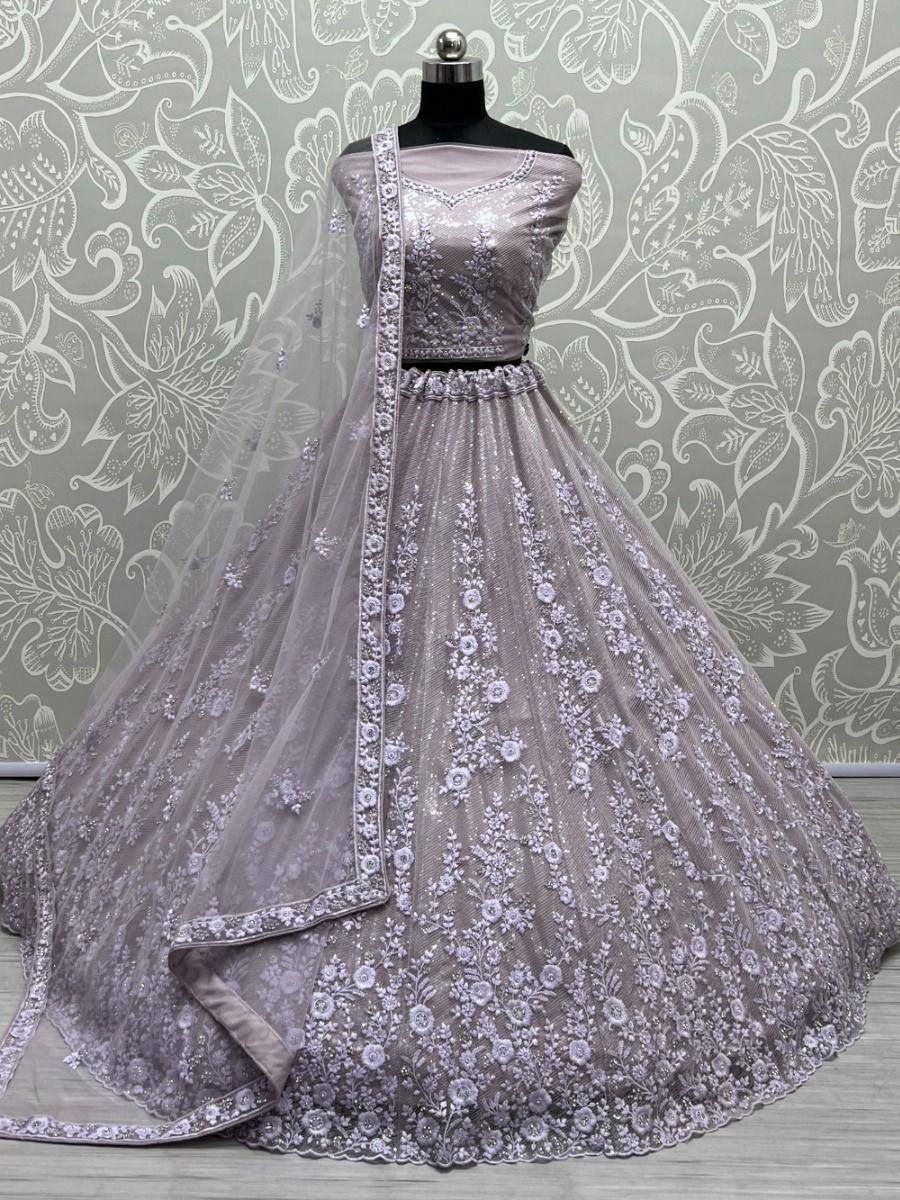Elegant lavender lehenga choli with floral embroidery, perfect for Indian weddings and festive occasions.
