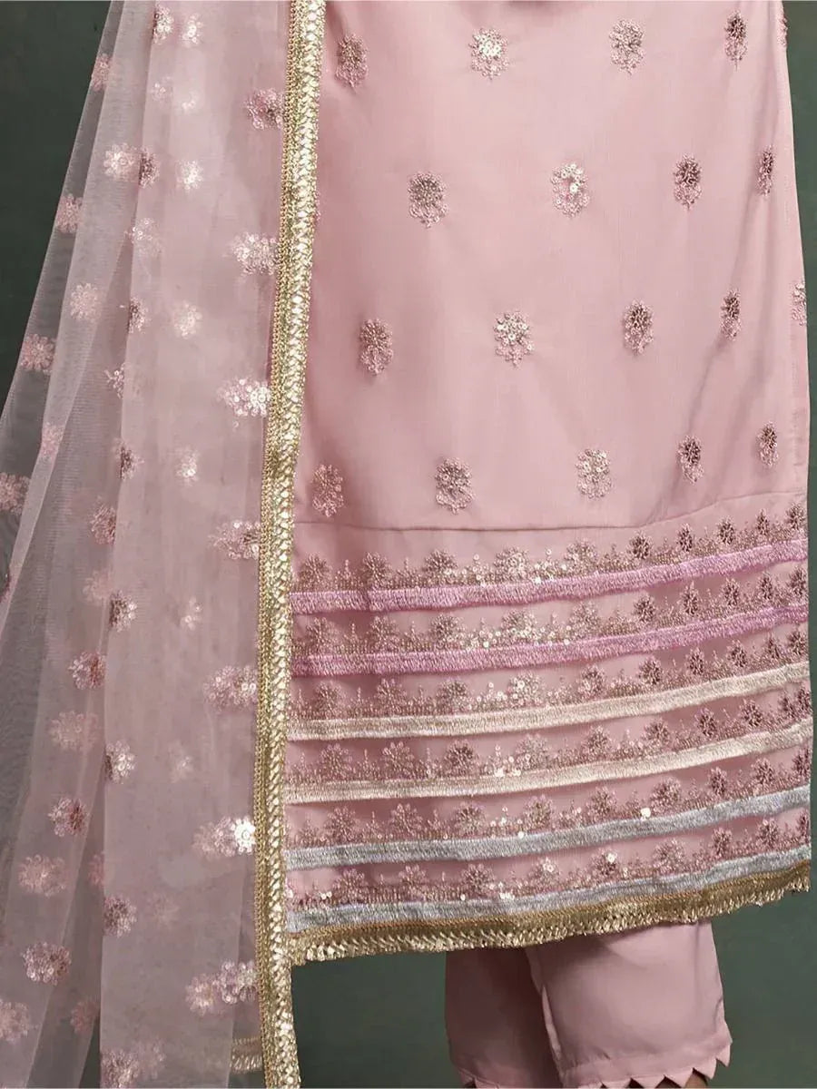 Pink embroidered salwar kameez with gold trim and floral sequin detailing, perfect for ethnic wear occasions.