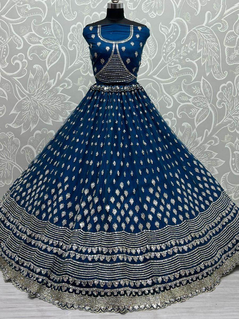 Stunning Blue Zircon Heavy Embroidered Net Lehenga Choli
