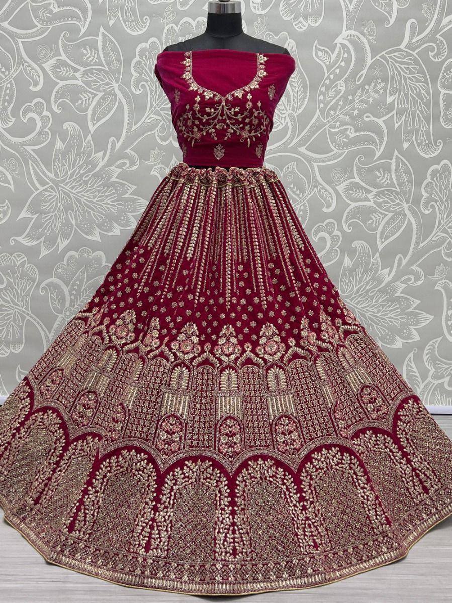 Maroon velvet designer lehenga choli with gold embroidery, perfect for Indian weddings and festive occasions