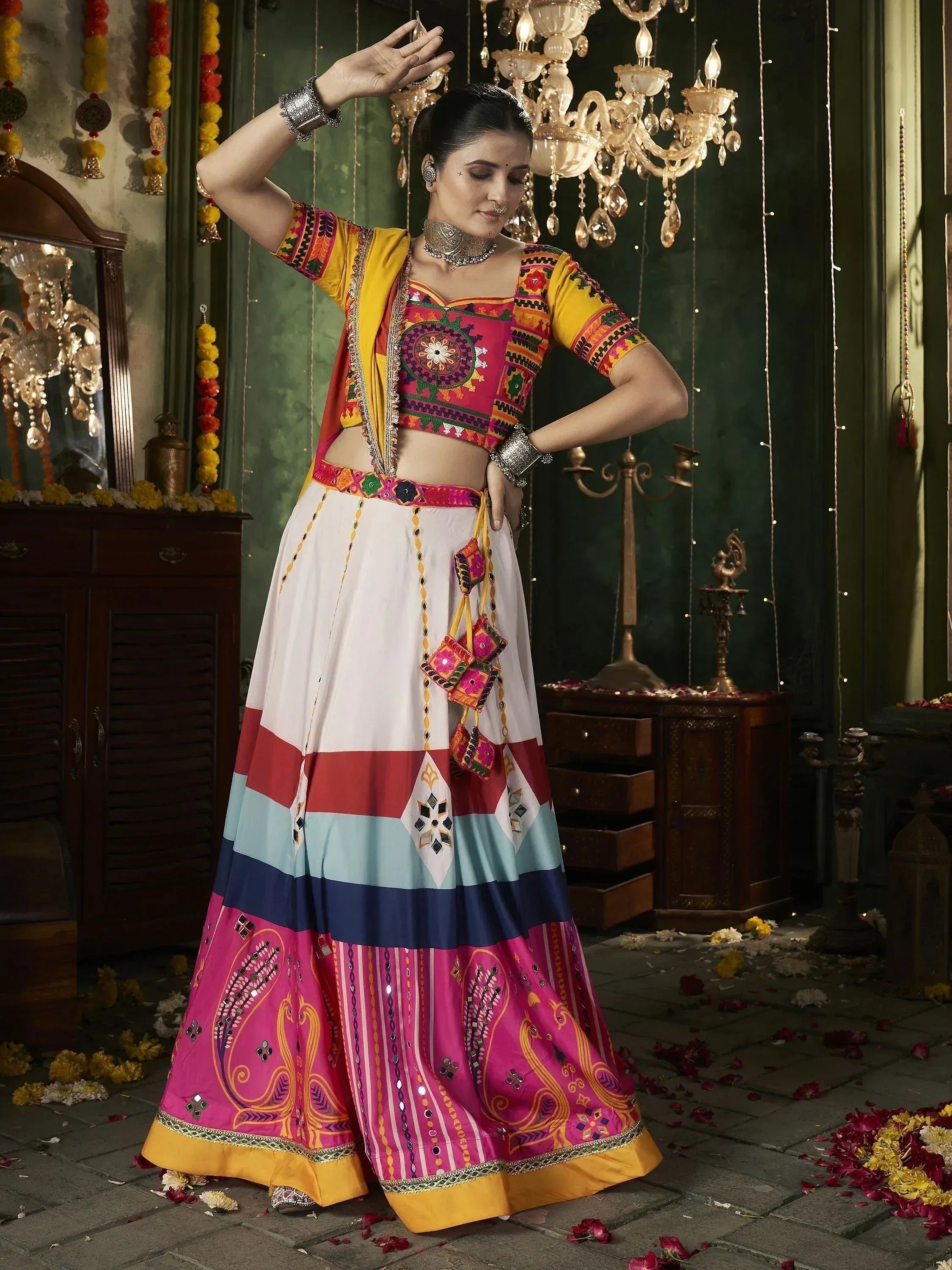 Vibrant Indian ethnic lehenga choli with colorful embroidery, mirror work, and traditional jewelry for festive occasions