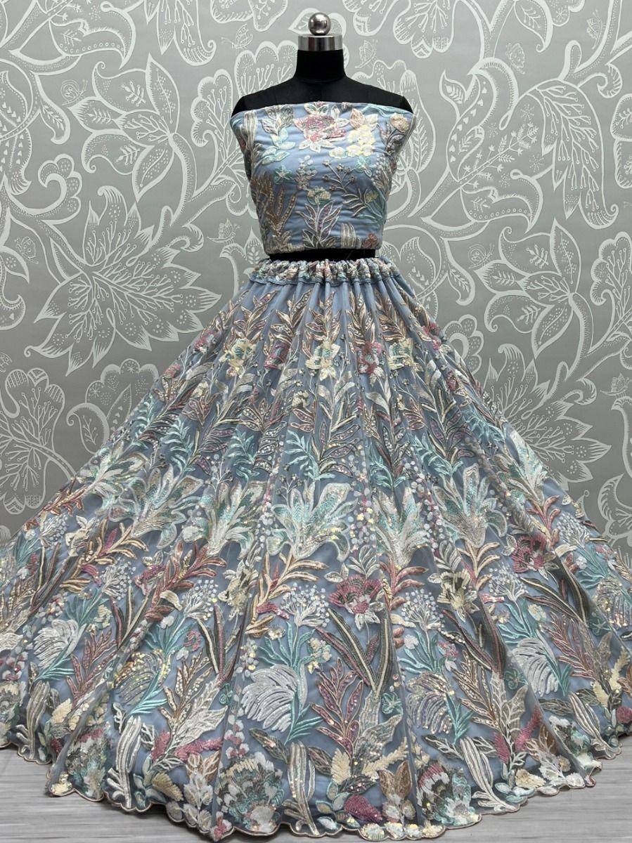 Blue floral embroidered lehenga choli with off-shoulder top, perfect for Indian weddings and festive occasions