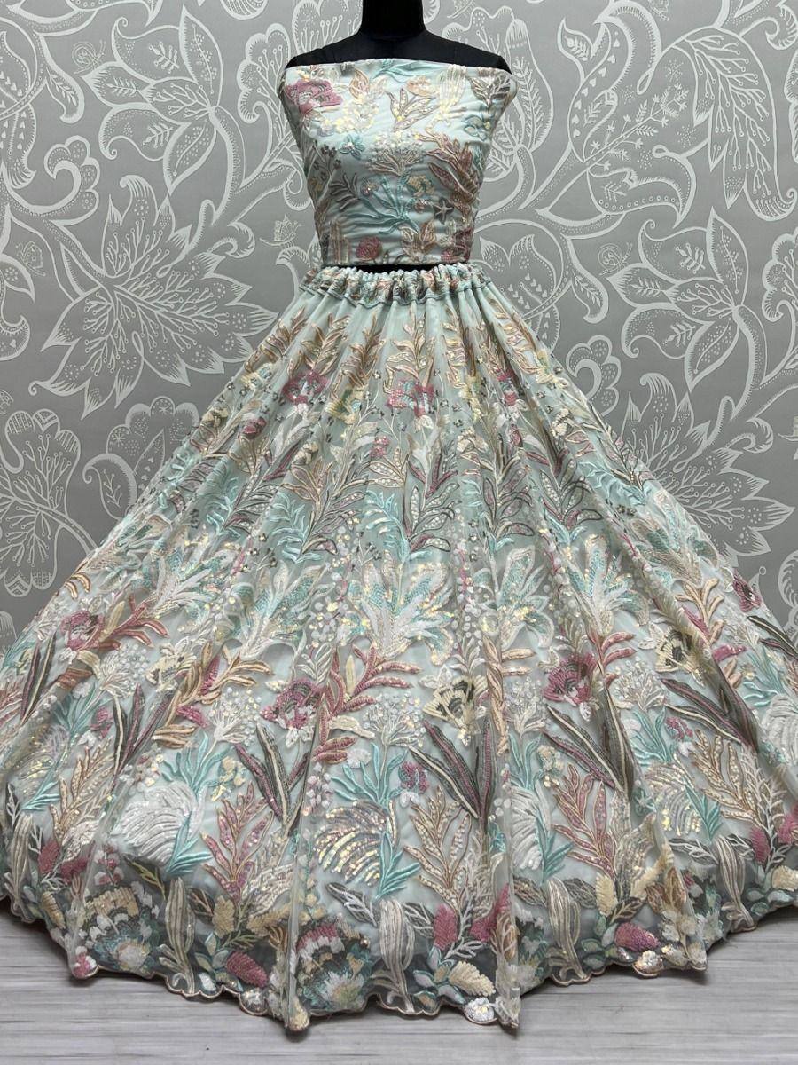 Mint green embroidered ethnic gown with floral motifs, perfect for weddings and festive occasions