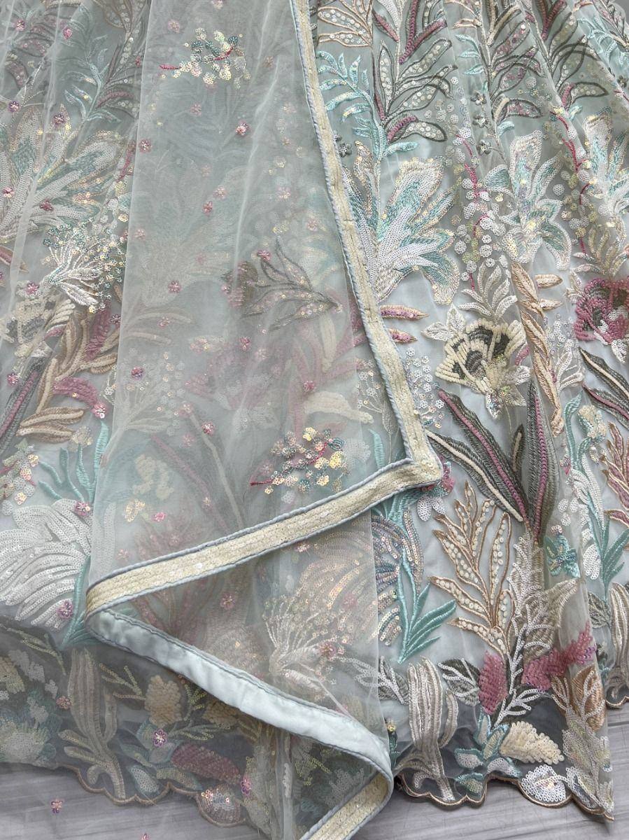 Elegant floral embroidered lehenga with sheer dupatta, perfect for Indian ethnic wear occasions.