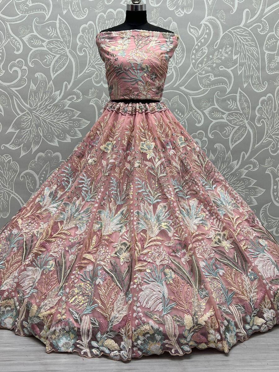 Pink floral embroidered lehenga choli with off-shoulder blouse, perfect for Indian weddings and festive occasions