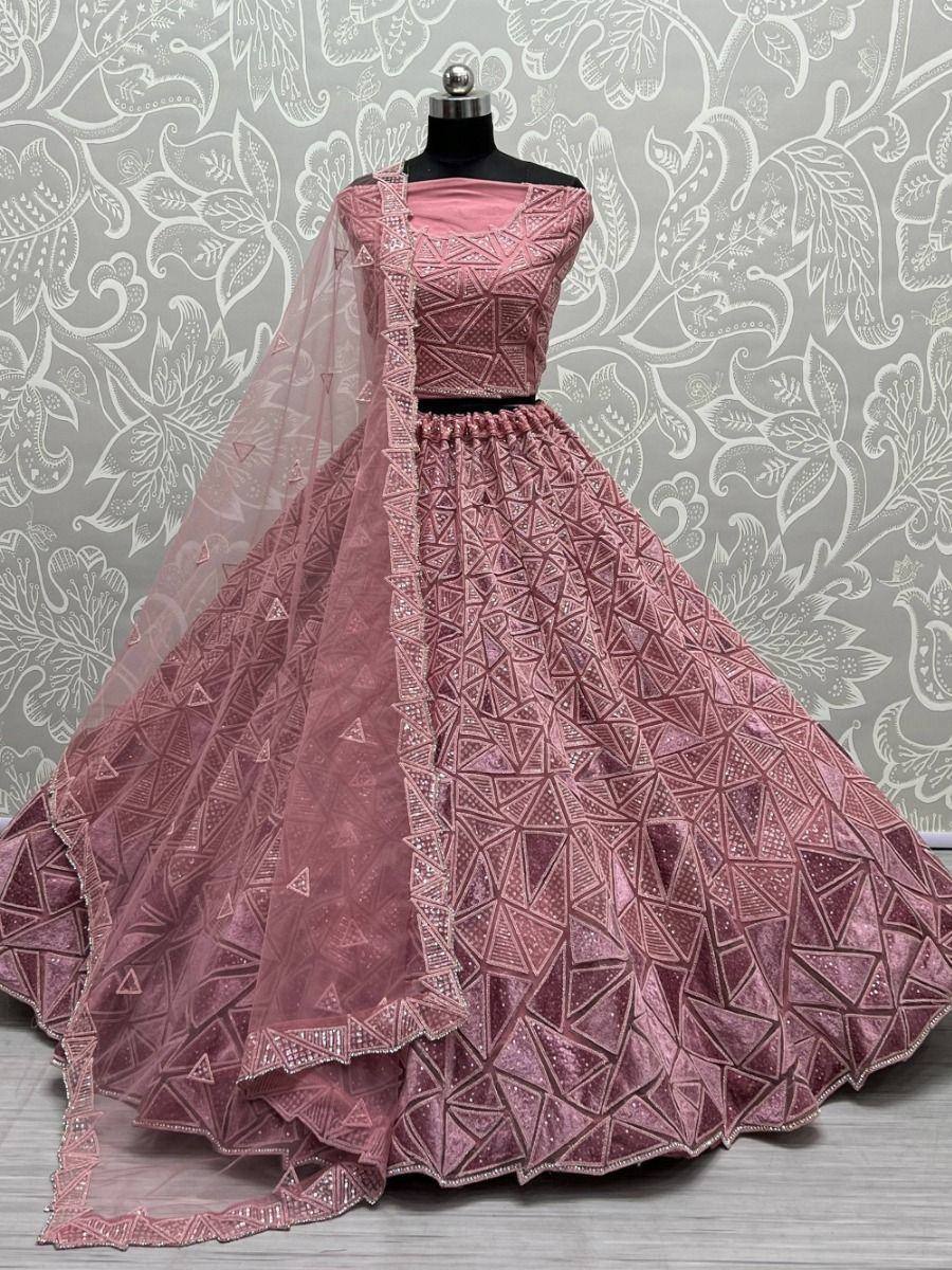Pink designer lehenga choli with geometric embroidery and sheer dupatta, ideal for weddings and festive occasions