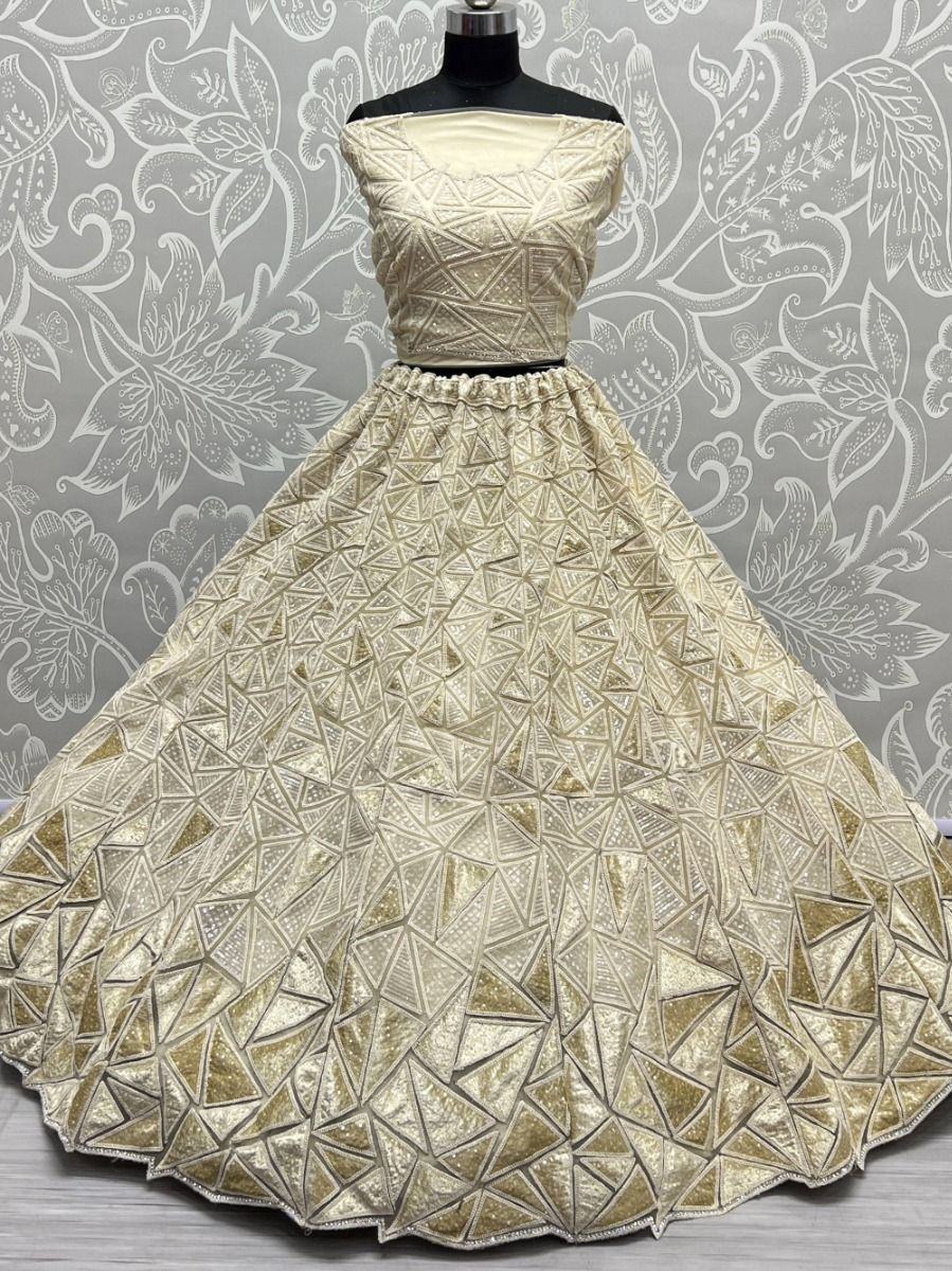 Fascinating Beige Sequins Embroidered Net Lehenga Choli