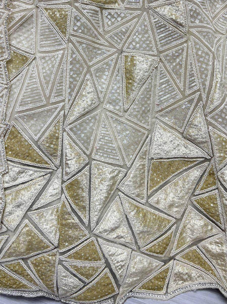 Fascinating Beige Sequins Embroidered Net Lehenga Choli