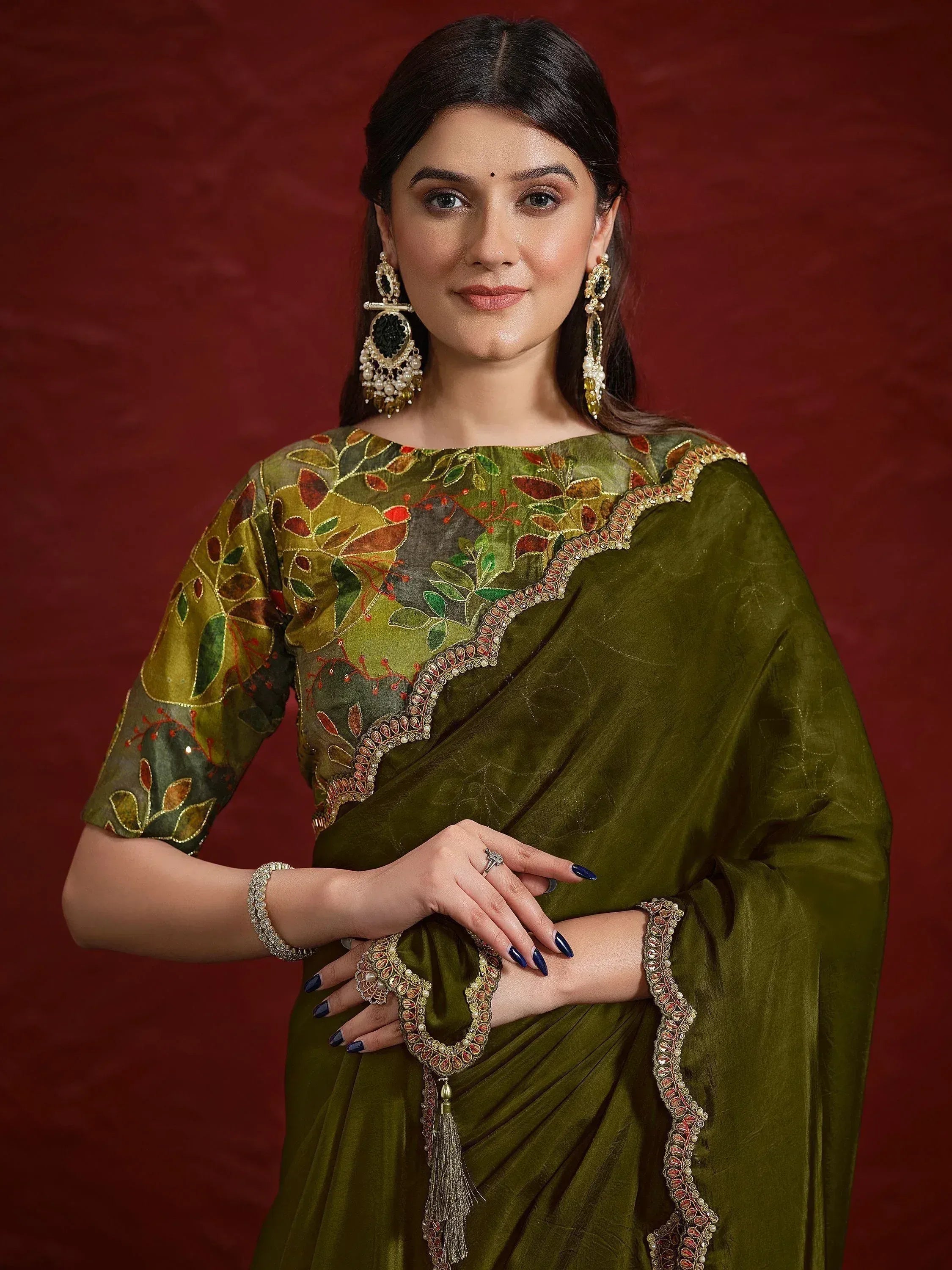Olive green embroidered saree with leaf motifs, perfect for Indian ethnic wear occasions