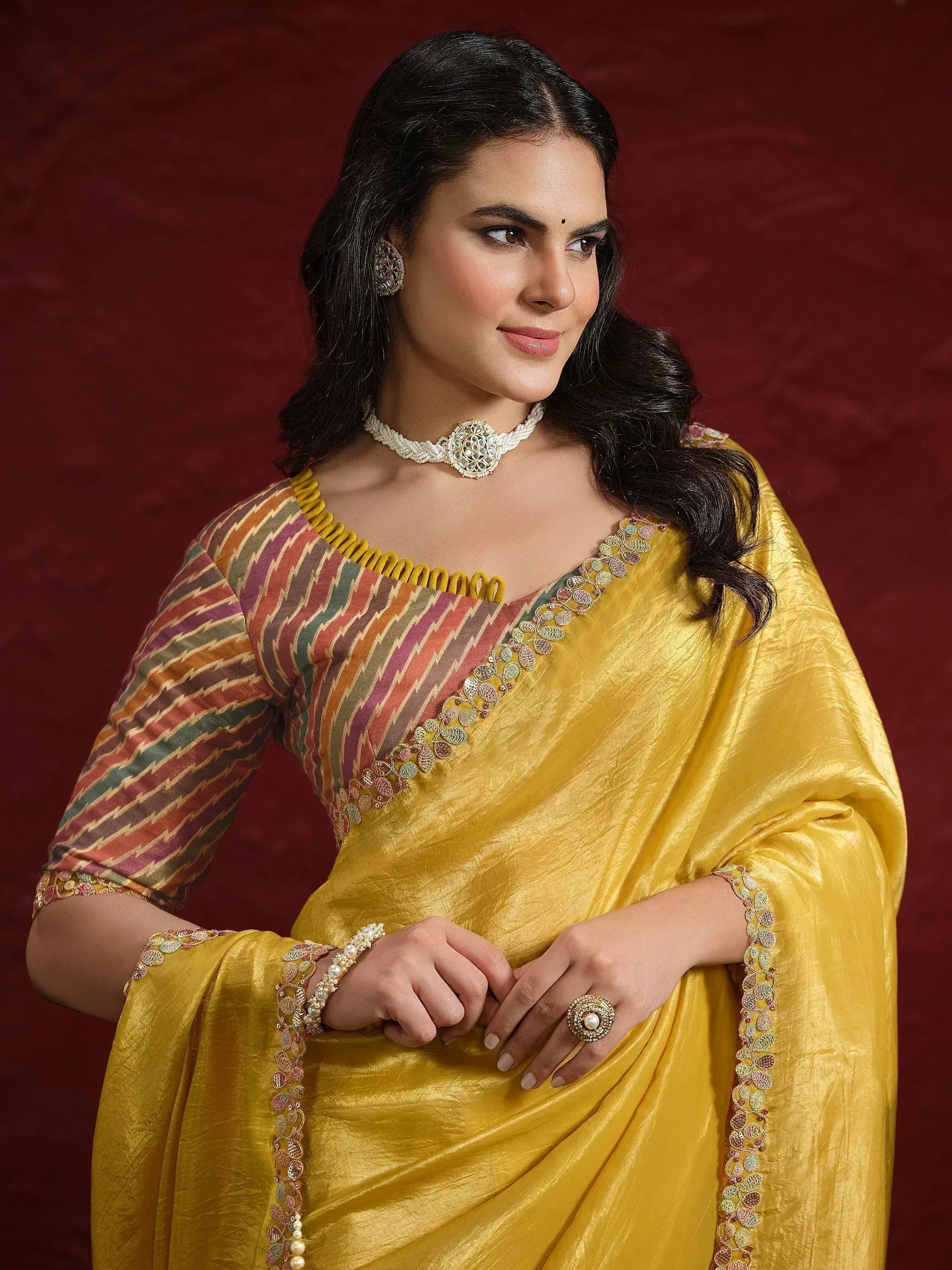 Yellow ethnic saree with colorful ikat blouse, perfect for Indian occasions and festive wear.