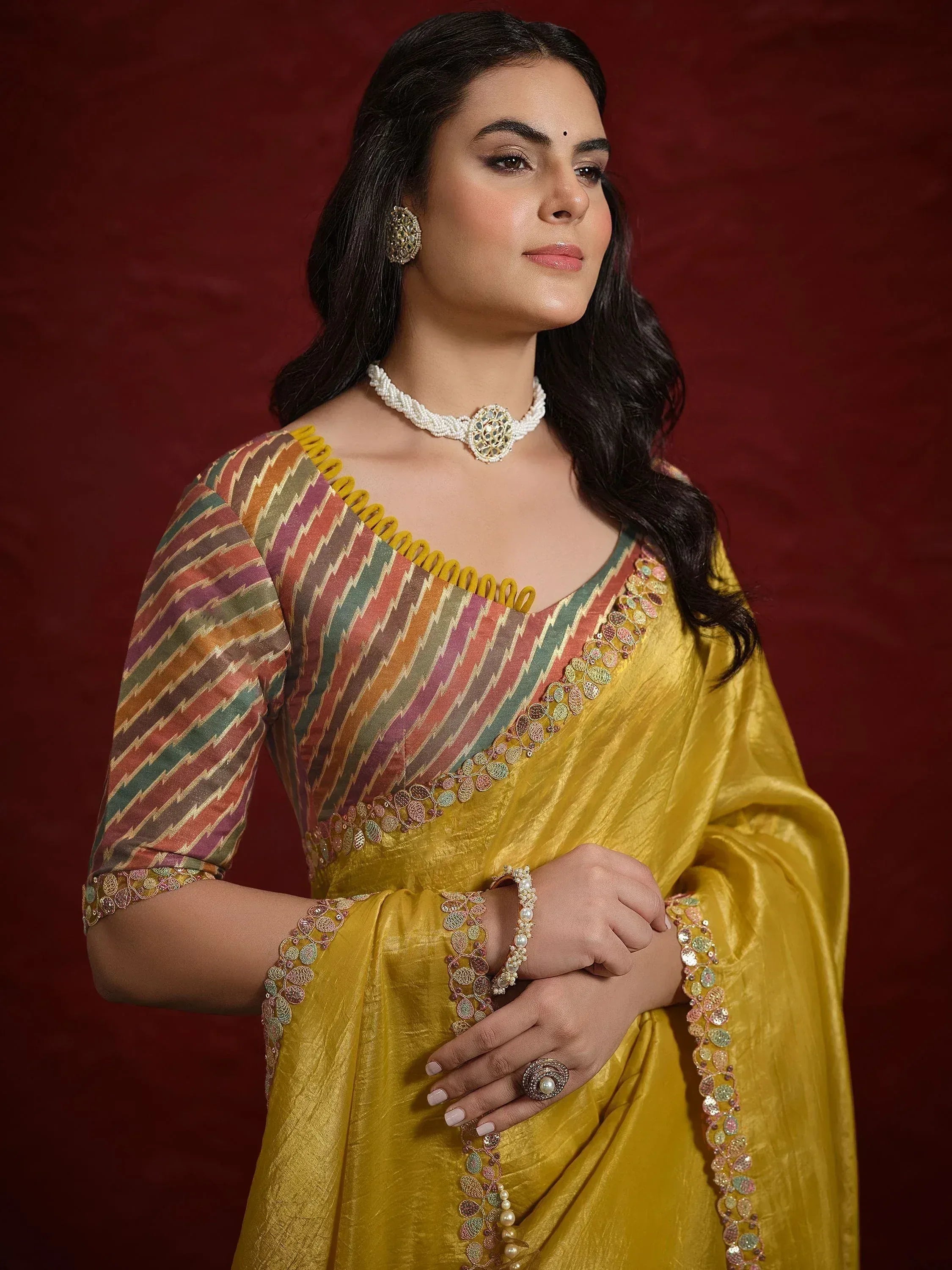 Yellow ethnic saree with multicolor ikat blouse, perfect for Indian weddings and festive occasions