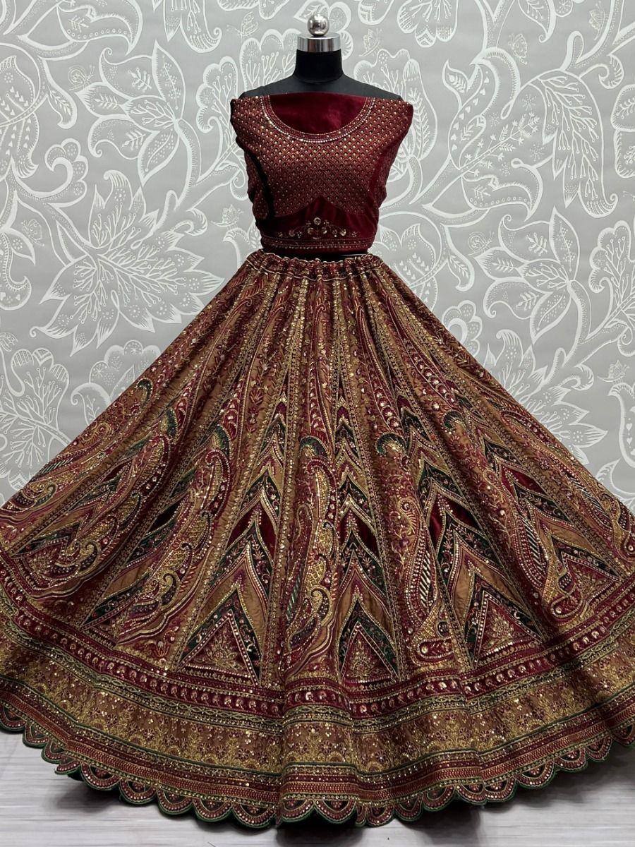Maroon and gold embroidered lehenga choli with intricate paisley patterns, perfect for Indian ethnic wear occasions.