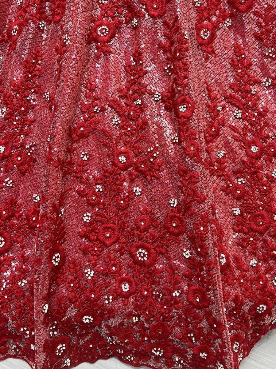 Red embroidered lehenga fabric with floral lace and sequin detailing for Indian ethnic wear