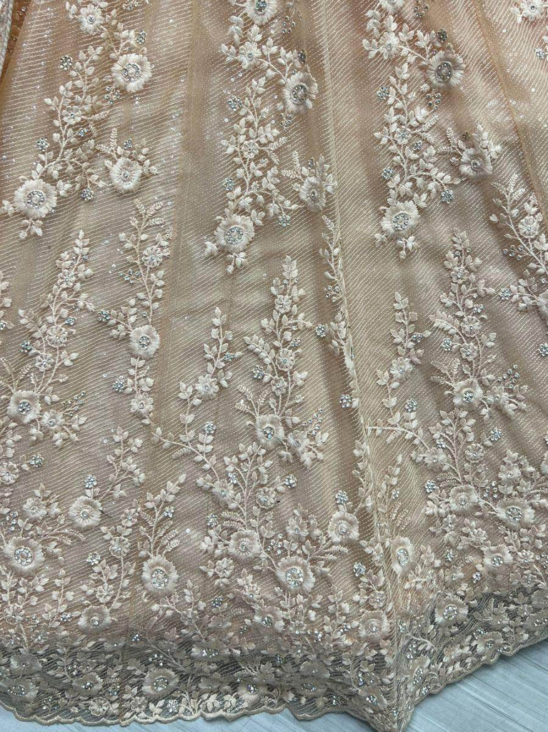 Astonishing Peach Zircon Diamond Work Net Lehenga Choli