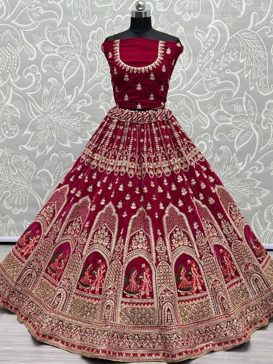 Maroon velvet lehenga choli with gold embroidery and temple motifs, ideal for weddings and festive occasions