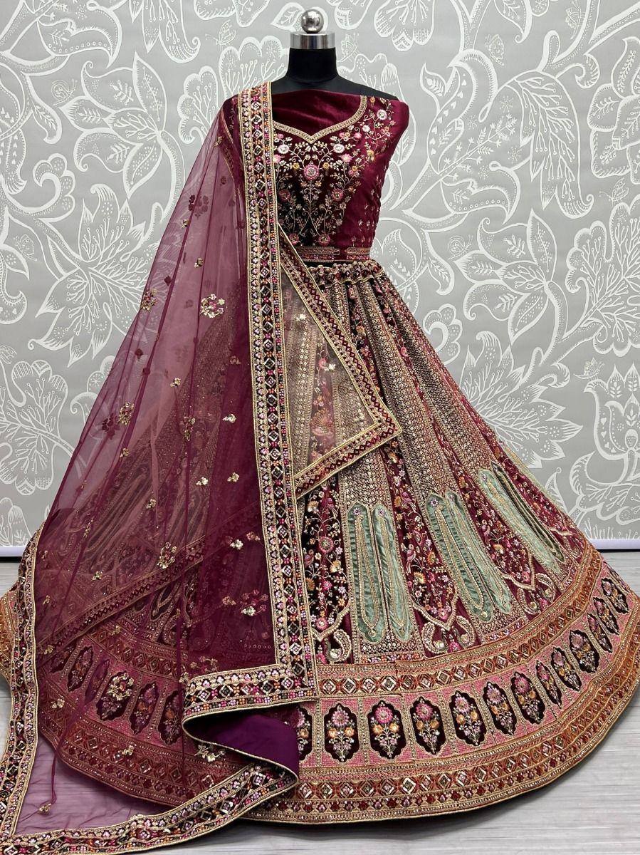 Maroon designer lehenga choli with heavy embroidery and net dupatta, perfect for weddings and festivals