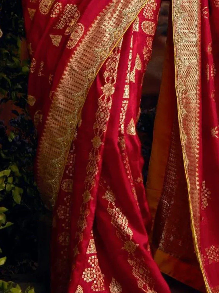Red ethnic saree with gold zari embroidery and intricate border design