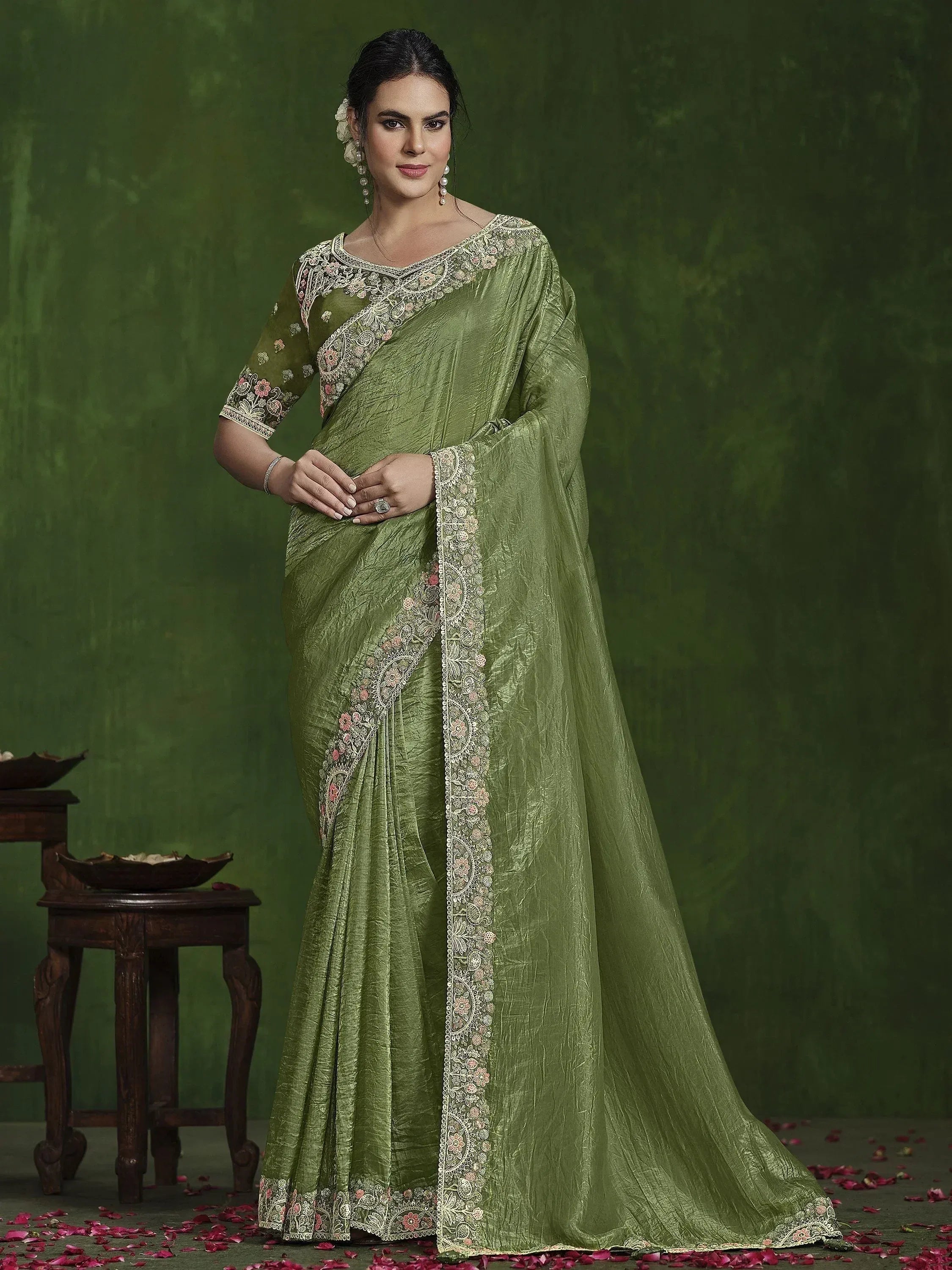 Olive green embroidered saree with floral lace border, perfect for Indian ethnic occasions