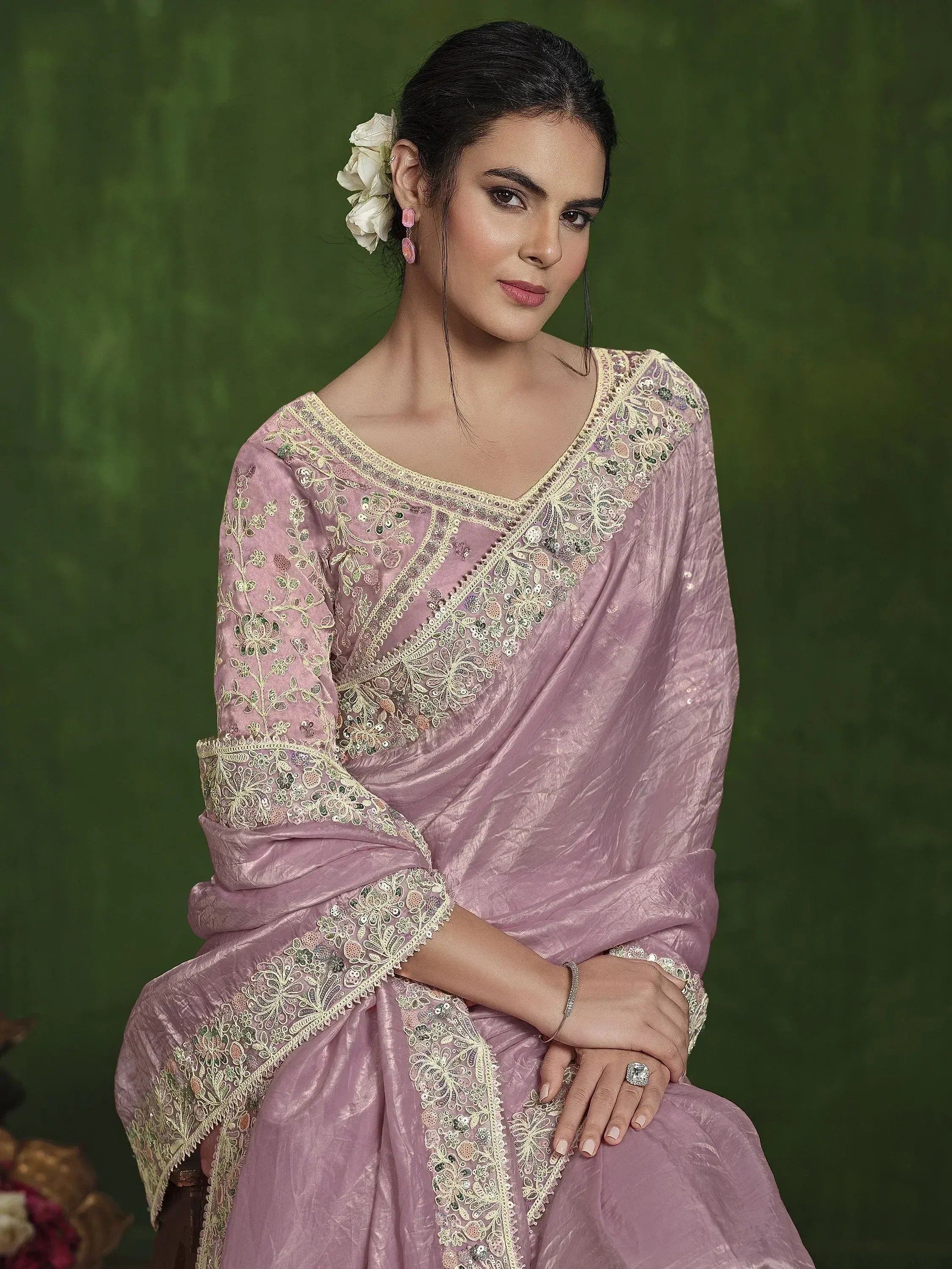 Elegant pink ethnic gown with gold embroidery, perfect for Indian celebrations and weddings