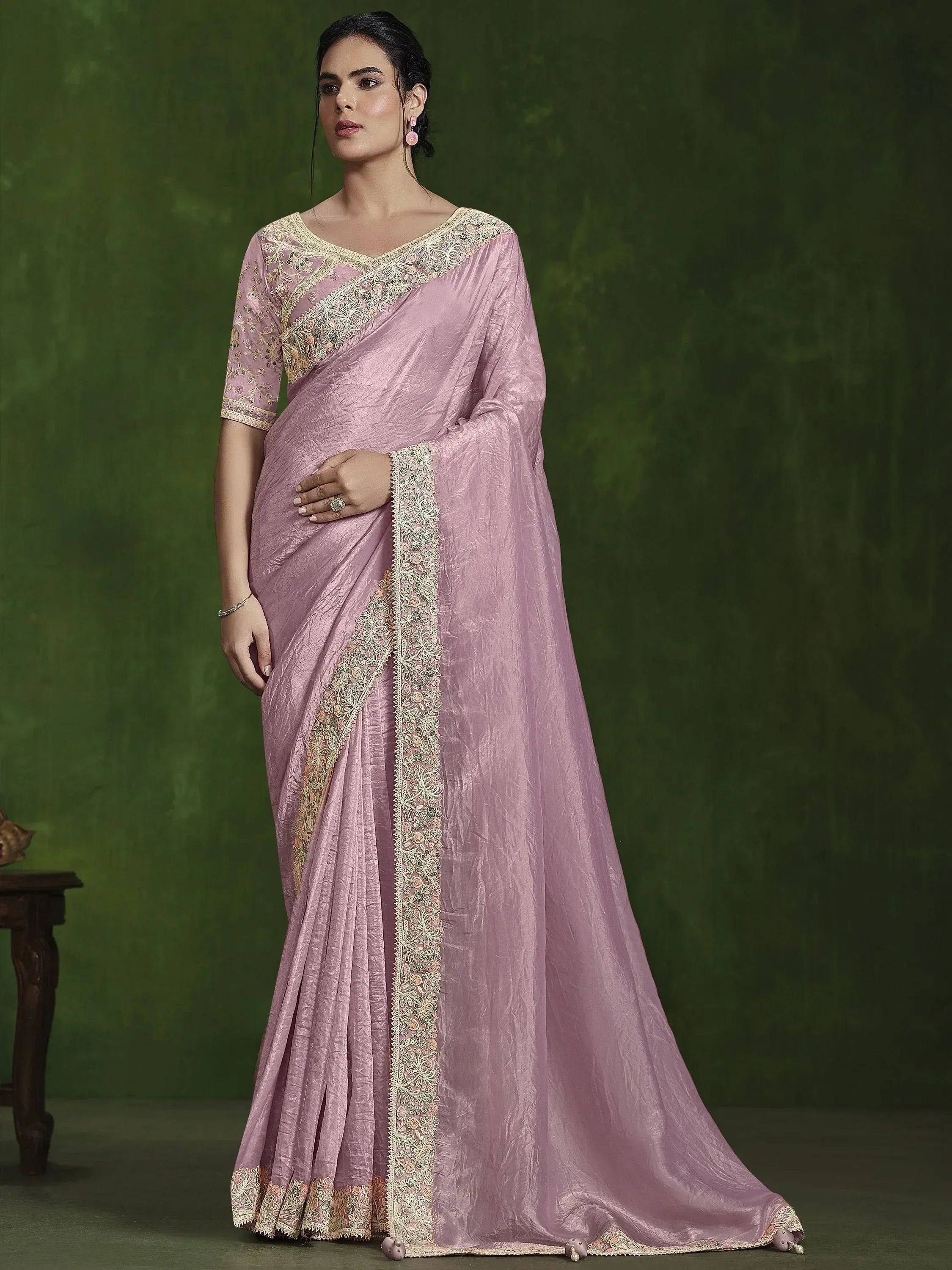 Pink embroidered saree with gold lace detailing, perfect for Indian ethnic wear occasions