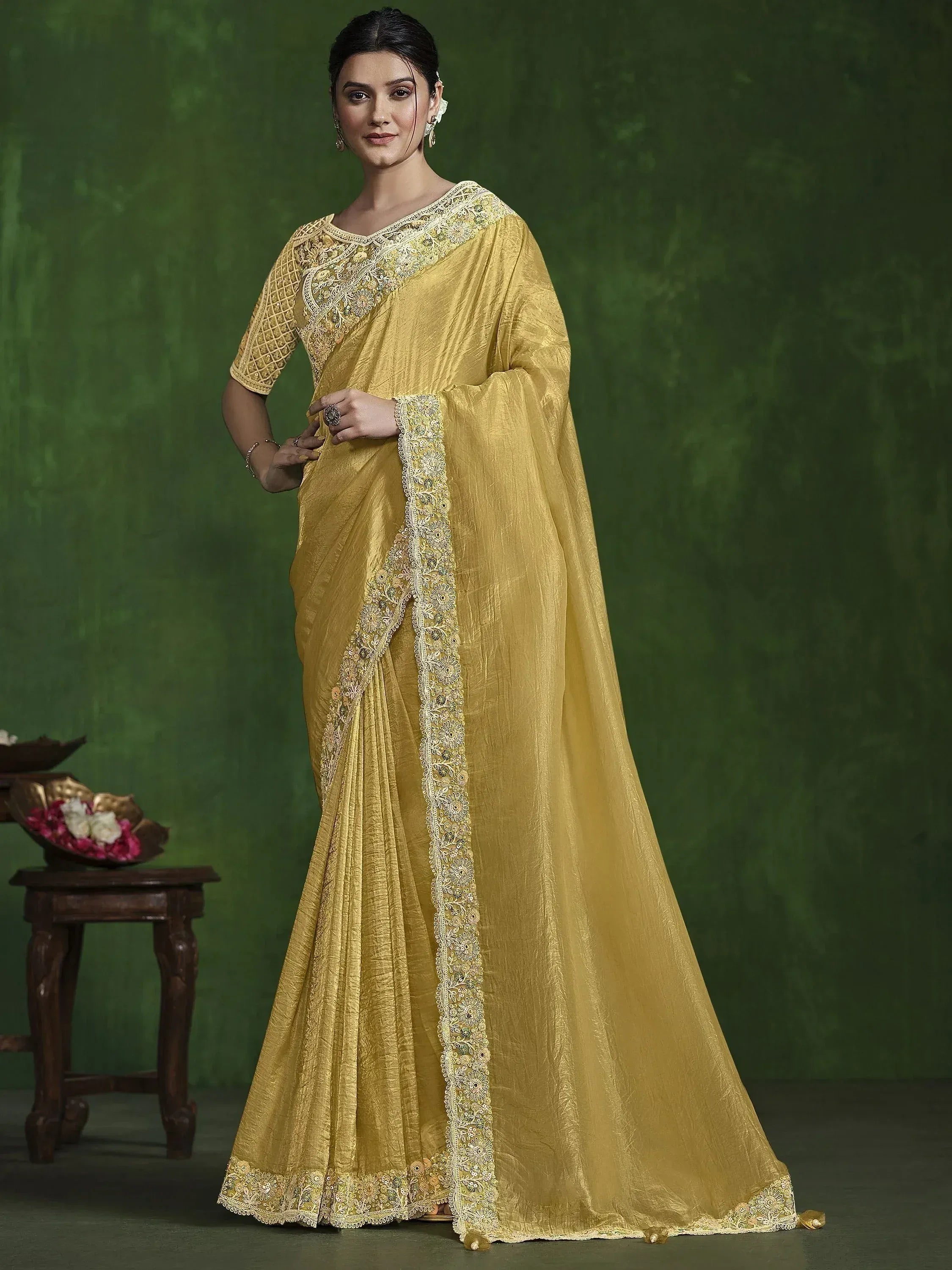 Elegant yellow saree with intricate embroidery, perfect for Indian ethnic wear occasions