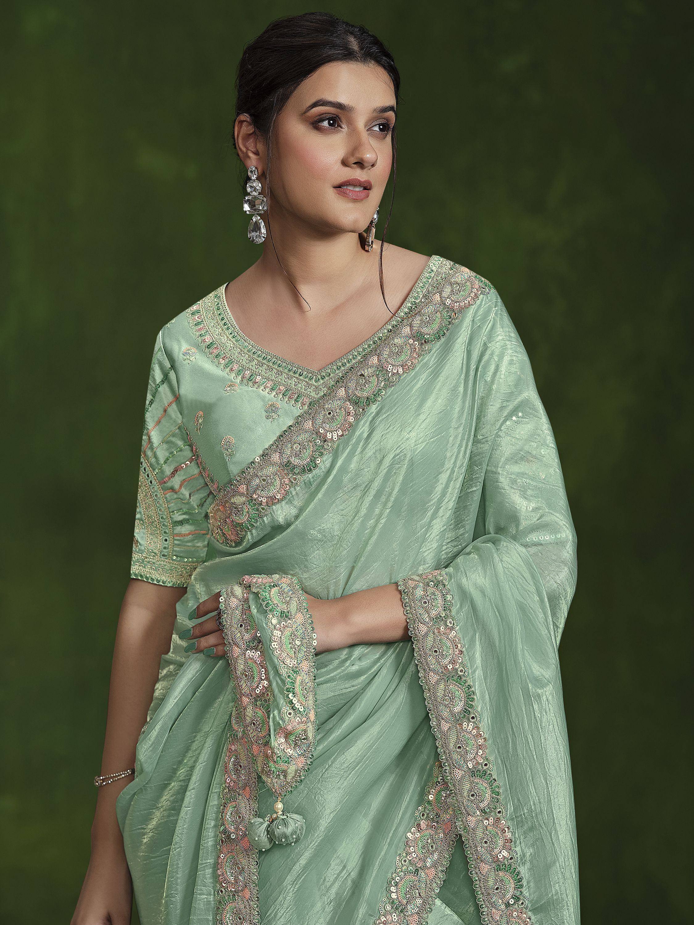 Mint green embroidered saree with sequin detailing, perfect for Indian ethnic occasions and festive wear.