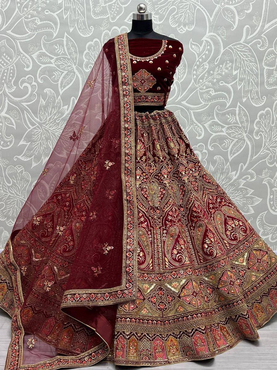 Maroon designer lehenga choli with gold embroidery and sheer dupatta, ethnic Indian wear for weddings