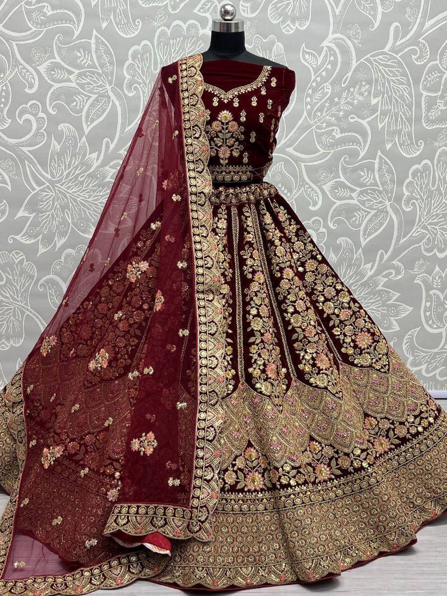 Maroon velvet lehenga choli with gold floral embroidery and matching dupatta, ideal for Indian weddings and festive occasions