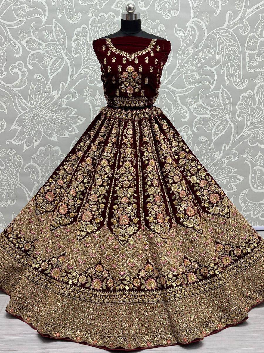 Maroon velvet lehenga choli with gold floral embroidery, perfect for Indian weddings and festive occasions