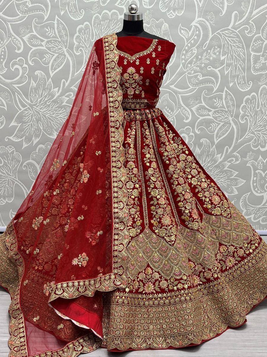 Red velvet lehenga choli with gold embroidery, perfect for Indian weddings and festive occasions
