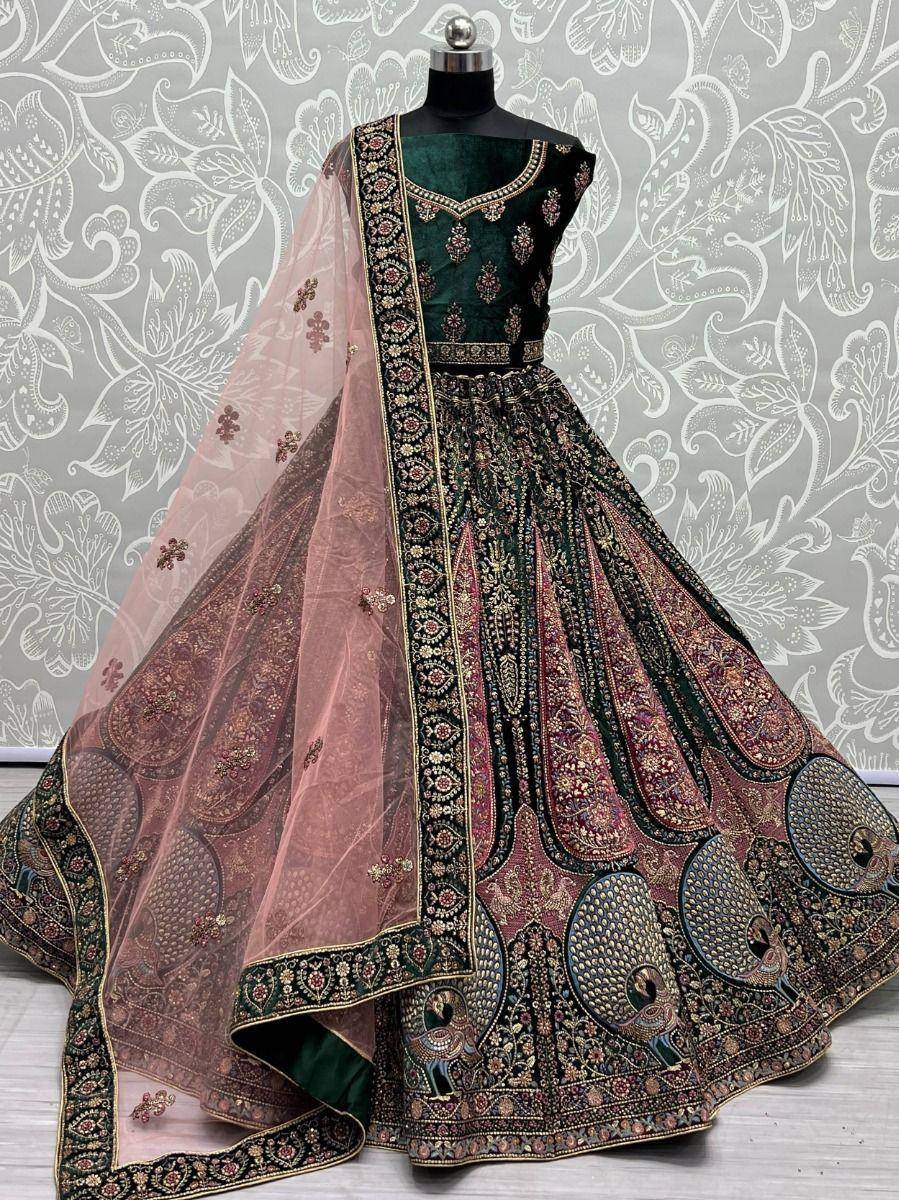 Emerald green designer lehenga choli with peacock embroidery and sheer pink dupatta, ethnic Indian wear