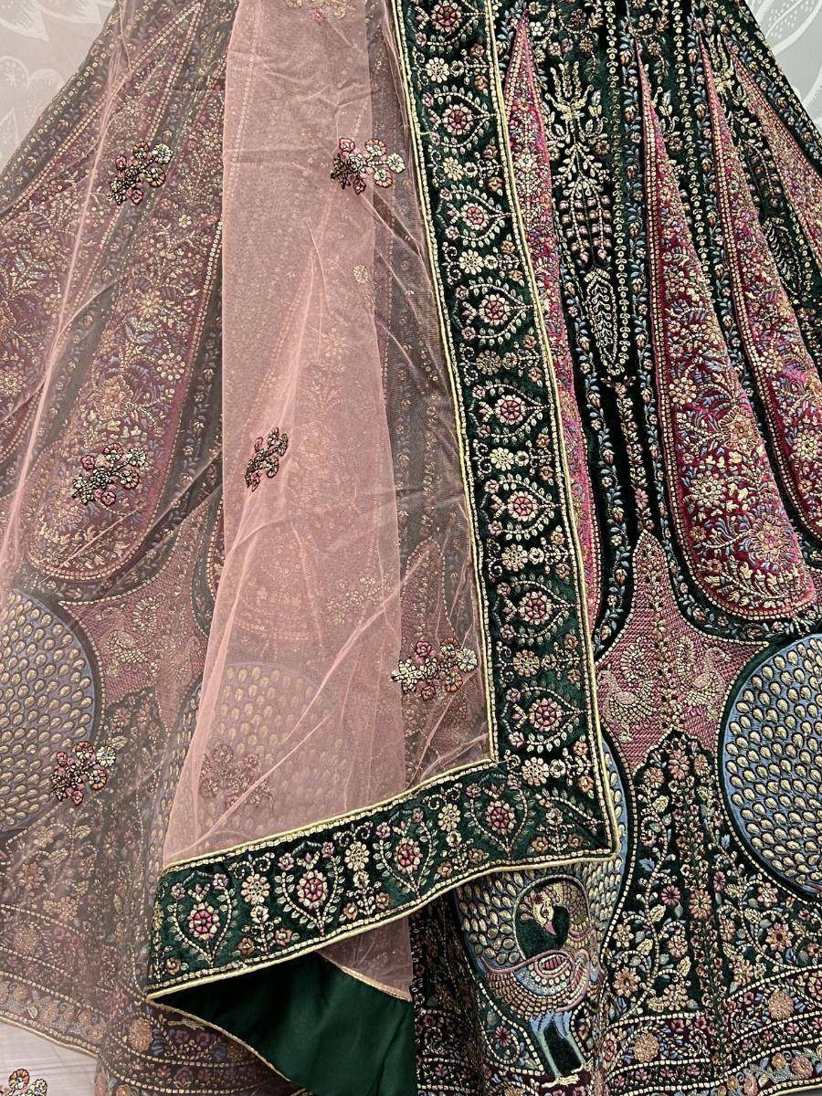 Designer lehenga choli with intricate embroidery, peacock motifs, and sheer dupatta for Indian ethnic wear