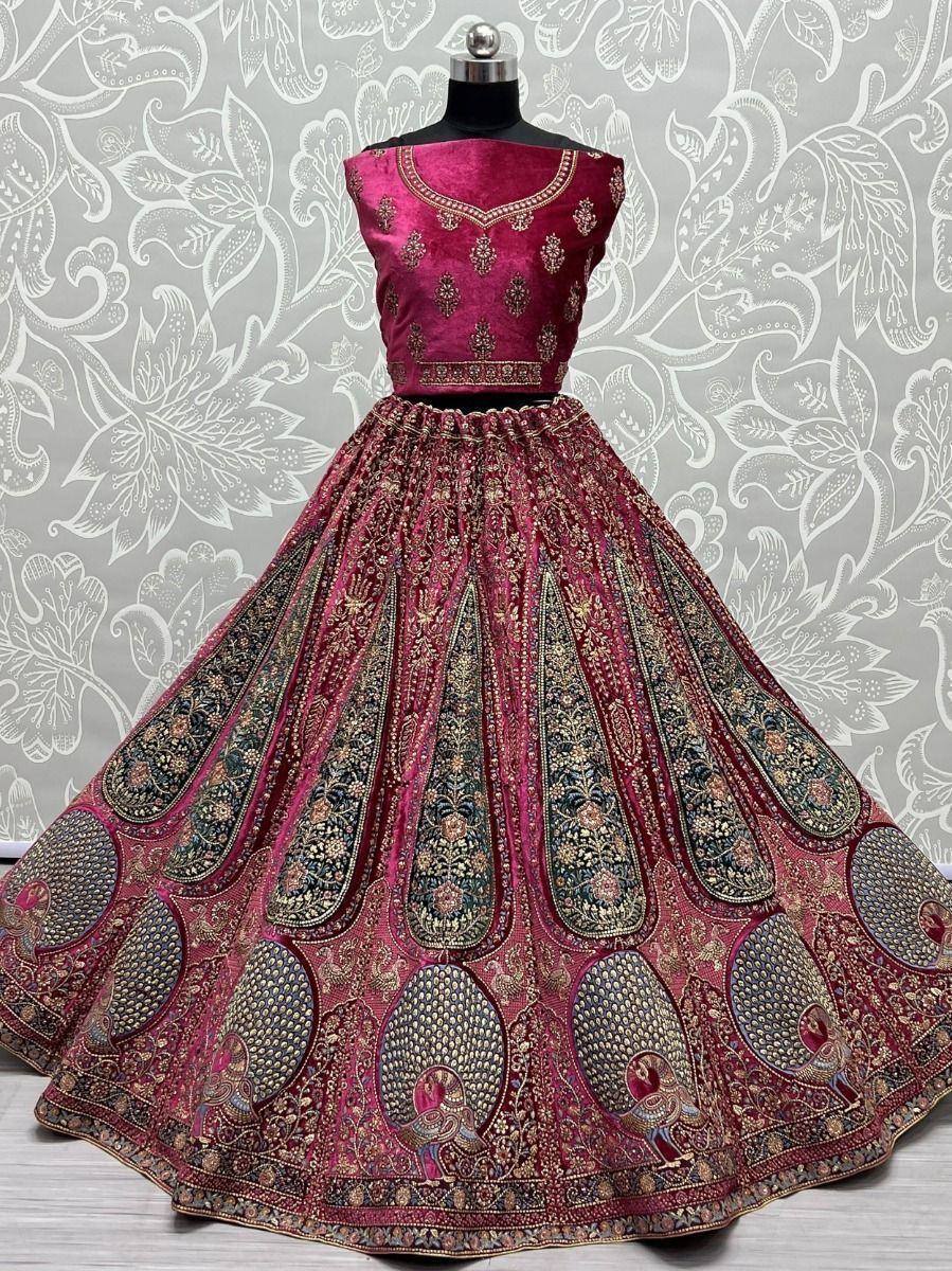 Luxury maroon lehenga choli with peacock embroidery, perfect for Indian weddings and festive occasions.