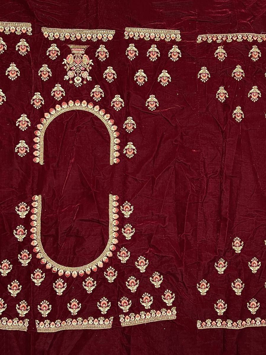 Maroon velvet ethnic blouse with gold and pink floral embroidery, perfect for Indian designer wear