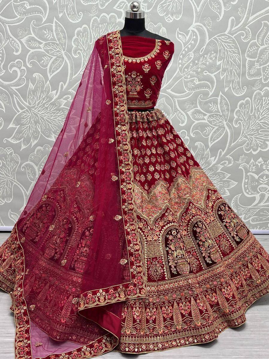 Maroon designer lehenga choli with heavy gold embroidery and net dupatta, perfect for weddings