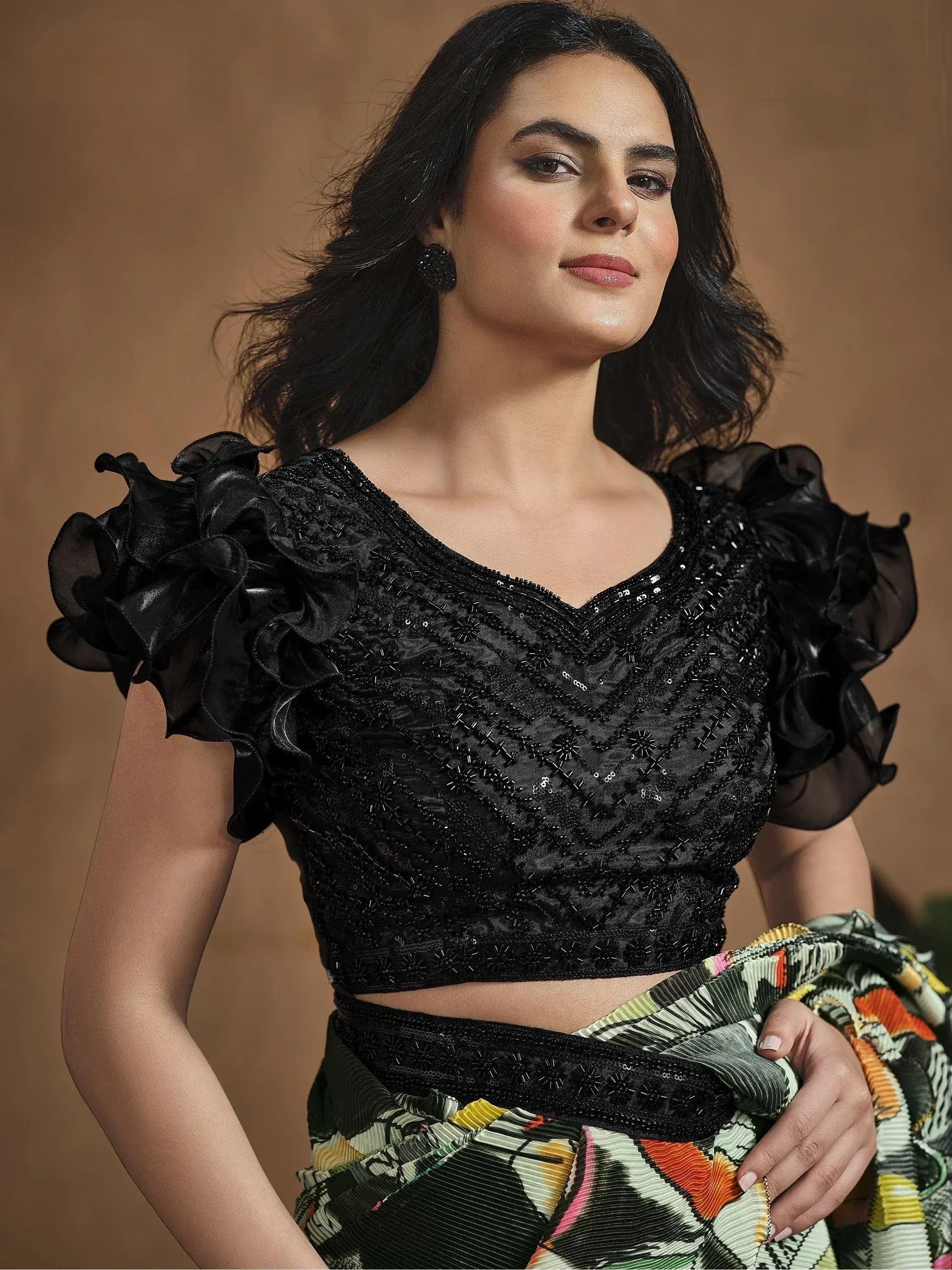 Black embroidered blouse with ruffled sleeves paired with printed saree, Indian ethnic wear
