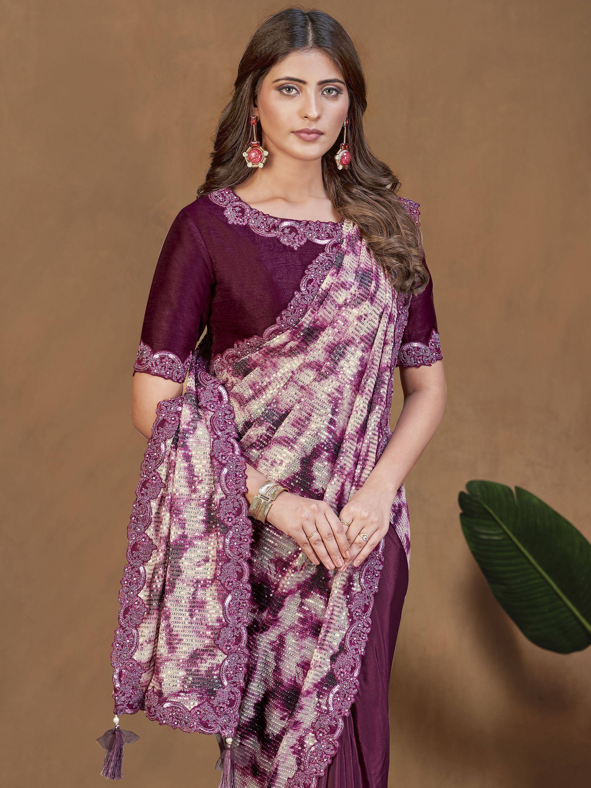 Purple ethnic saree with sequin work and lace border, perfect for Indian occasions