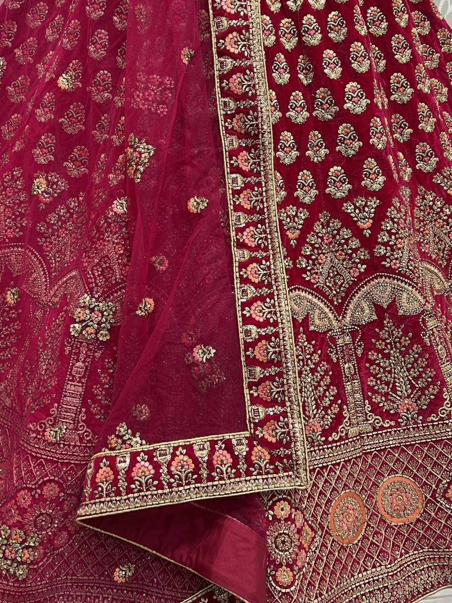 Rich maroon velvet lehenga with intricate gold and floral embroidery, perfect for Indian ethnic wear occasions.