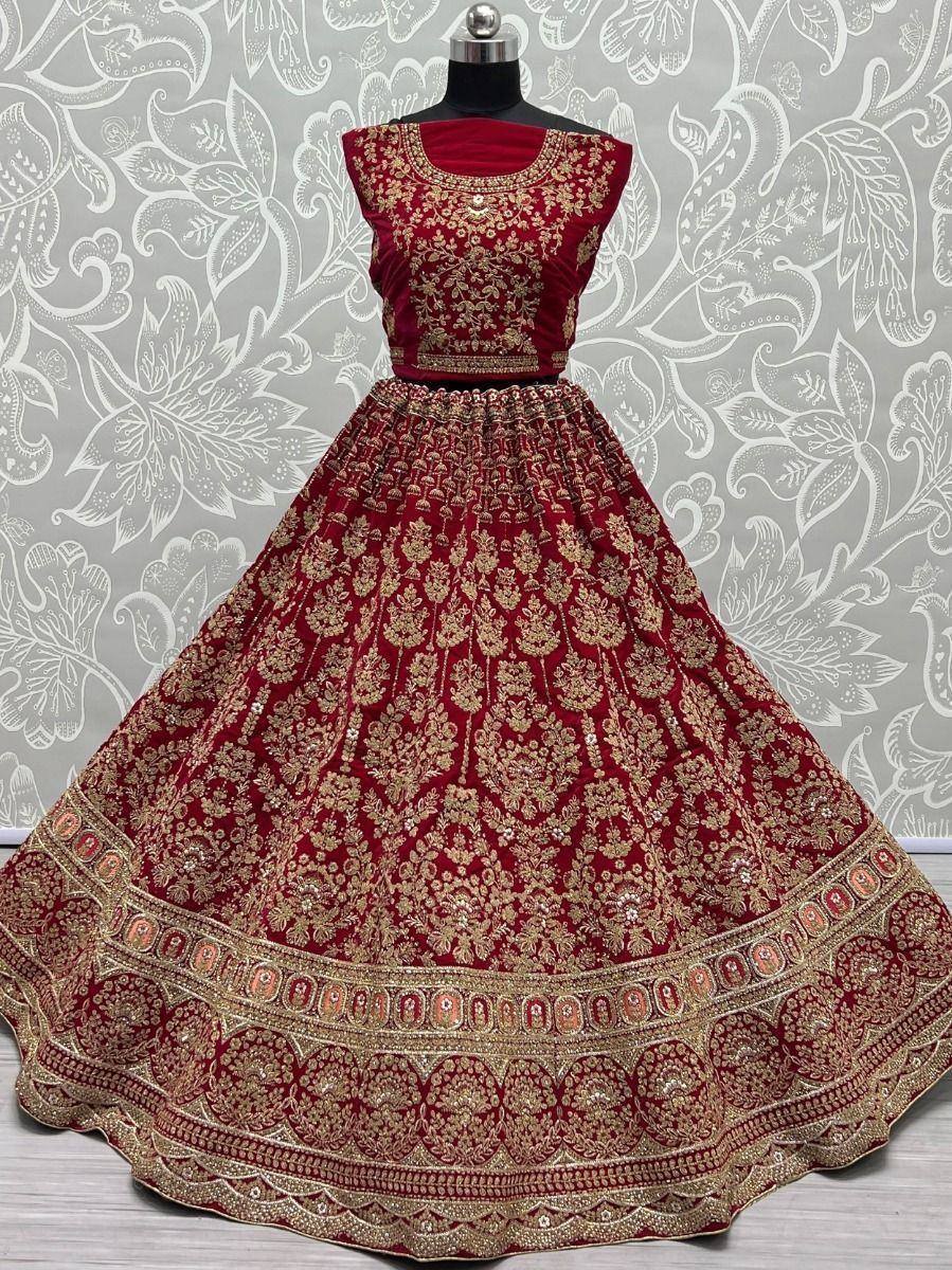 Red velvet lehenga choli with gold embroidery, perfect for Indian weddings and festive occasions