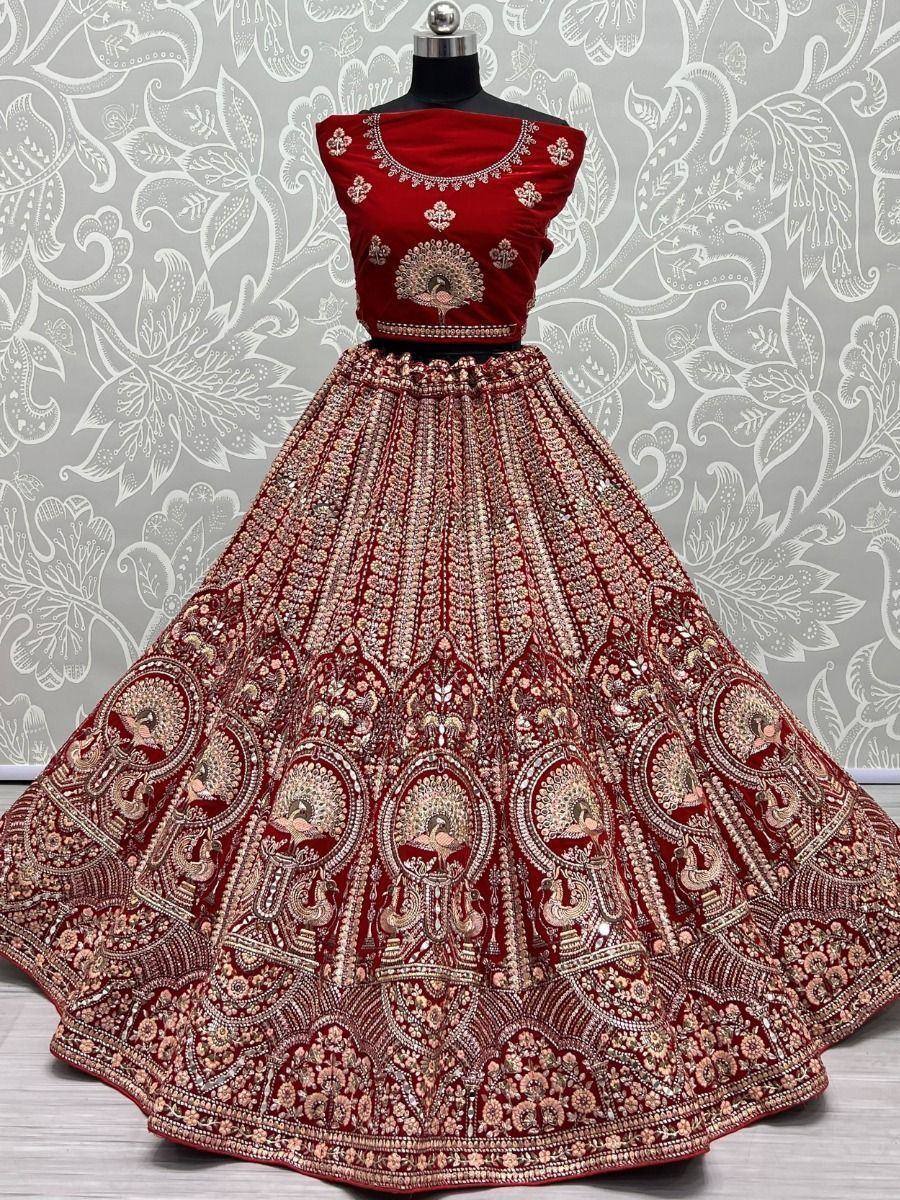 Red velvet lehenga choli with peacock embroidery, perfect for Indian weddings and festive occasions
