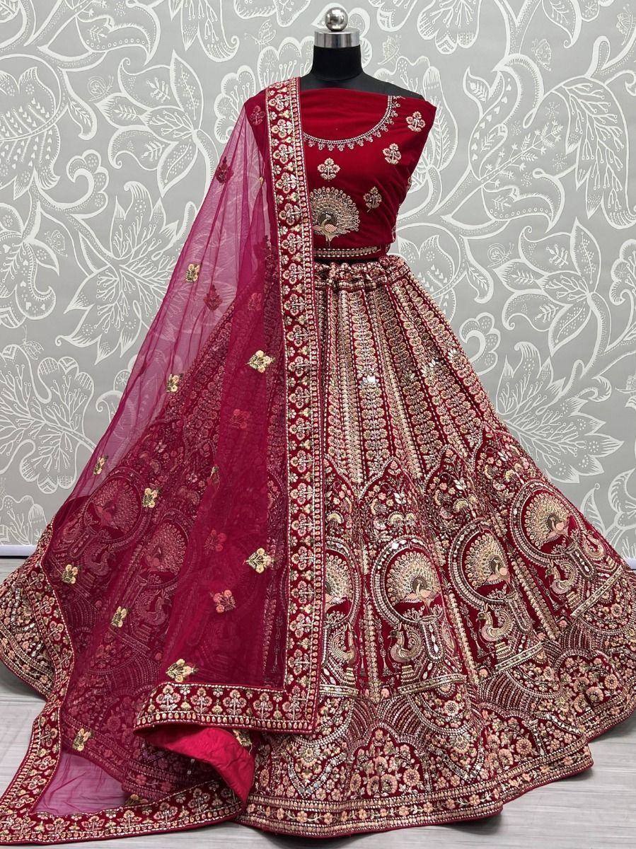 Maroon designer lehenga choli with heavy embroidery and peacock motifs, perfect for weddings and festive occasions.