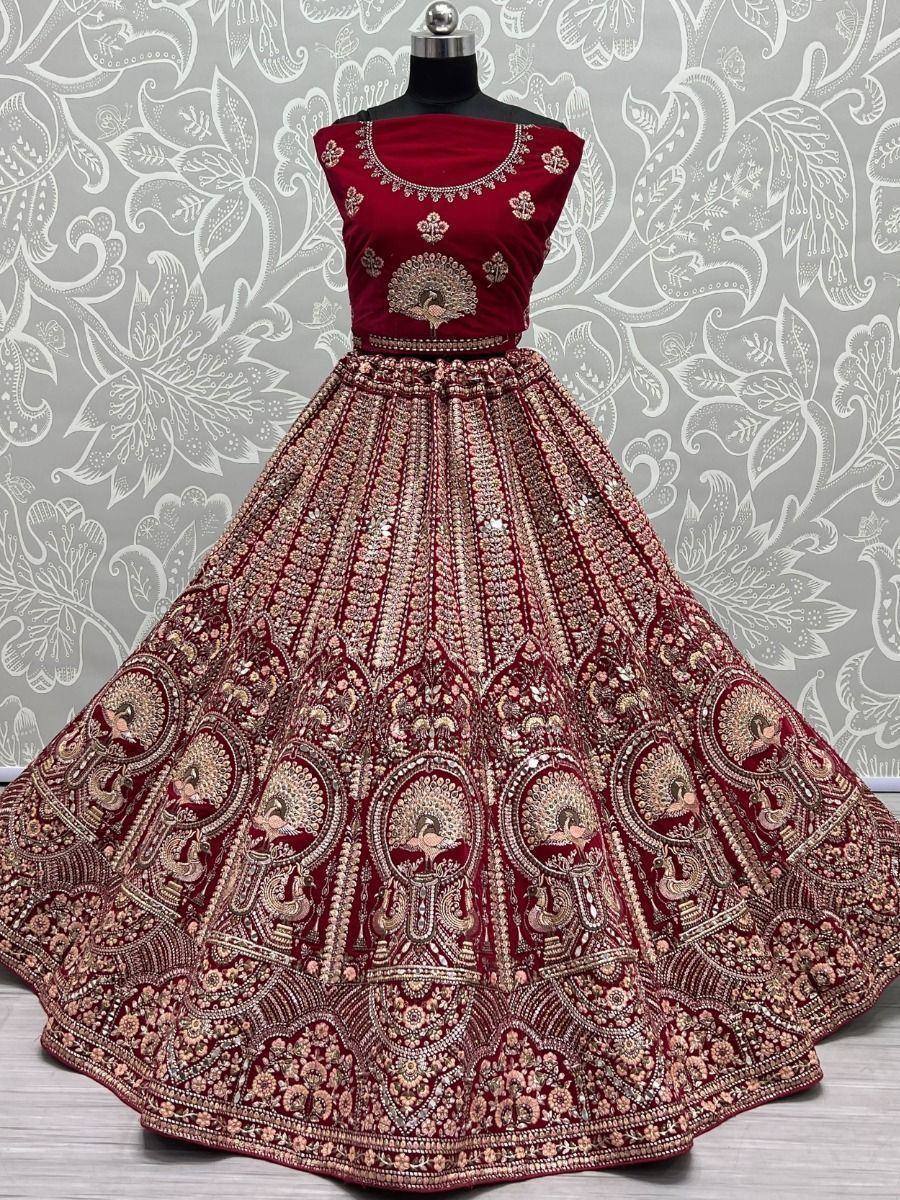 Maroon designer lehenga choli with peacock embroidery and heavy embellishments, perfect for Indian weddings