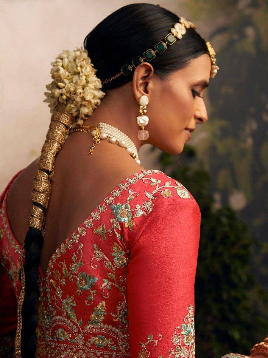 Red embroidered lehenga choli with floral jewelry and gajra, Indian ethnic wear
