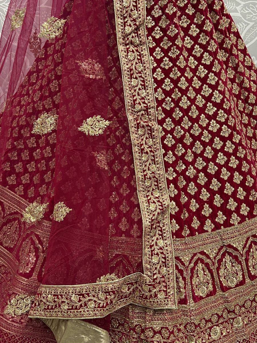 Maroon velvet lehenga choli with gold embroidery, designer ethnic wear for weddings
